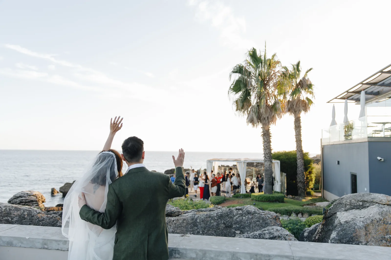 Bride ascending palace stairs with floral arch