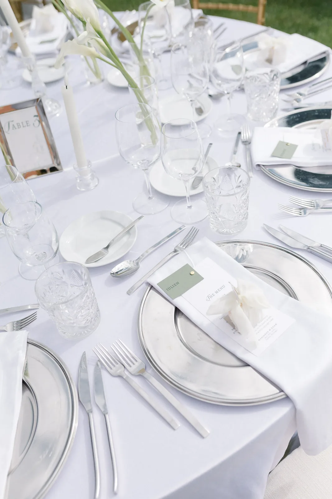 Aerial view of serpentine banquet tables on lawn