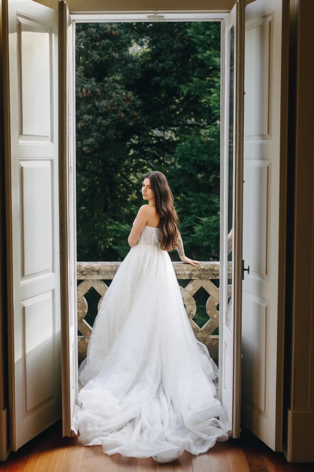 Couple with bouquet in garden setting