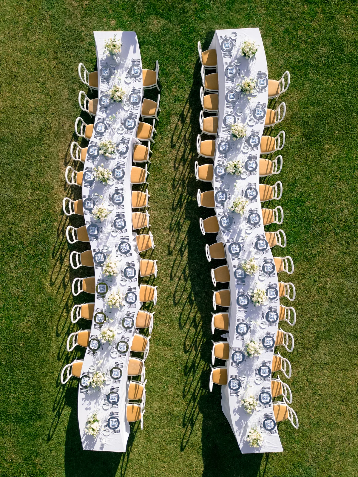 Wedding guests walking by historic Portuguese palace
