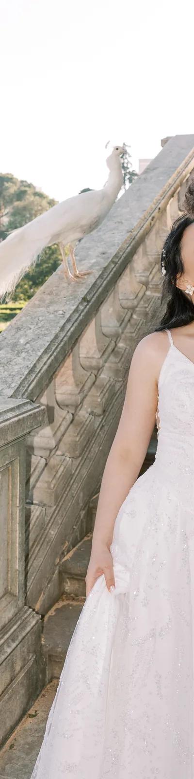Couple with calla lily bouquet, bride in lace halter-neck dress