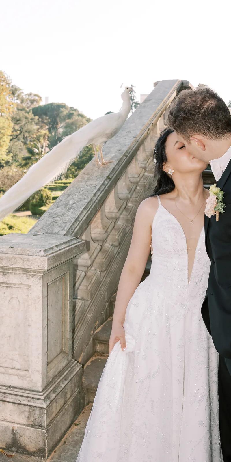 Couple with calla lily bouquet, bride in lace halter-neck dress