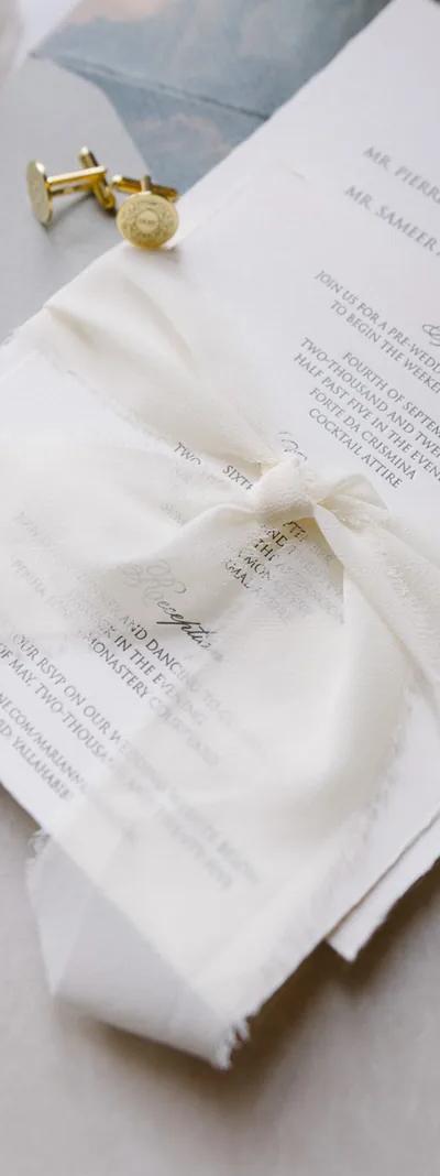 Luxury wedding invitation suite with silk ribbon and cufflinks