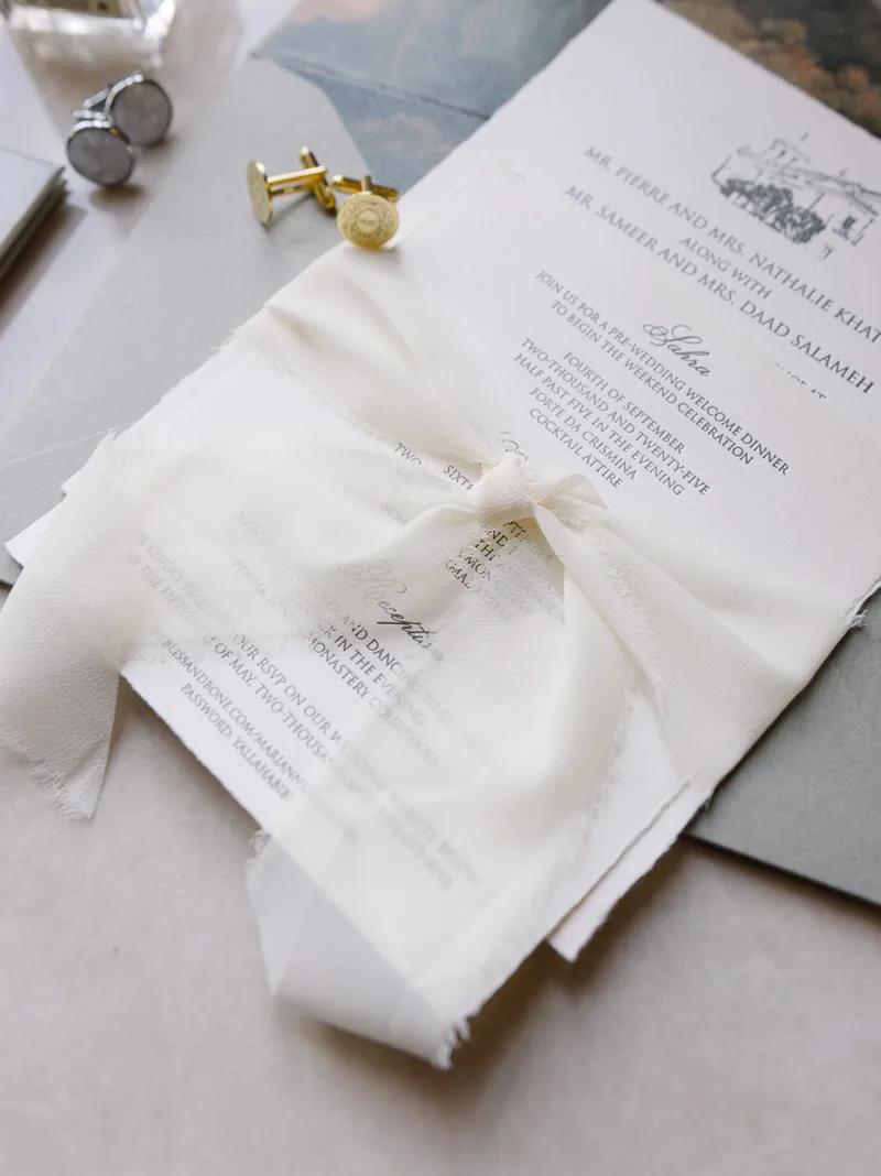 Luxury wedding invitation suite with silk ribbon and cufflinks