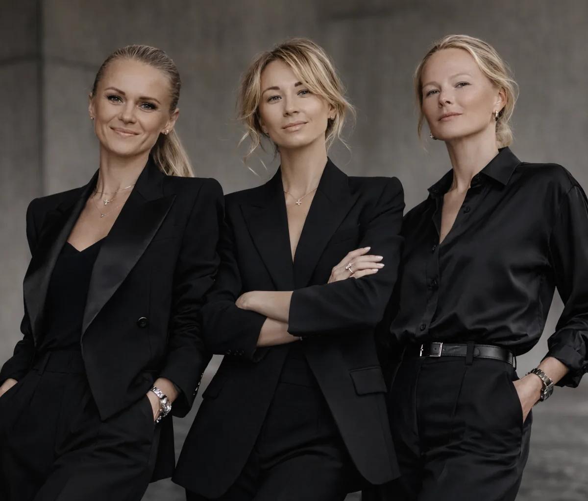 Event Boutique production team — three women in elegant black attire